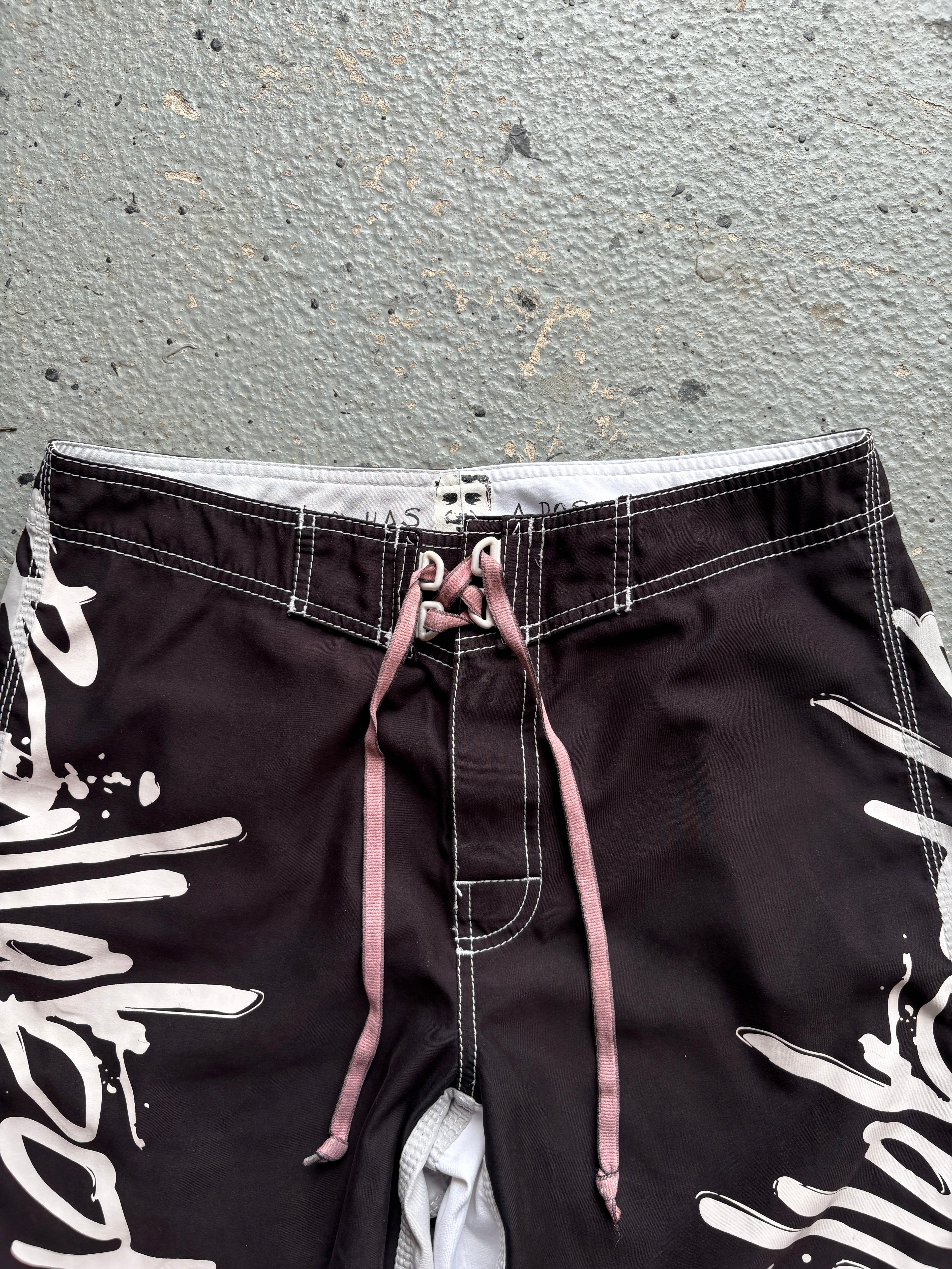 2000s Billabong "Occy Has A Possy" Board Shorts Black / White